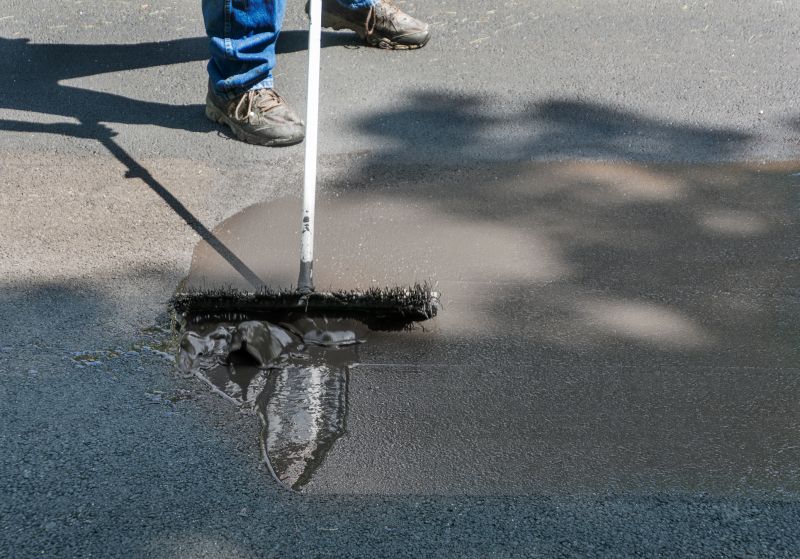 Expert preparing driveway surface