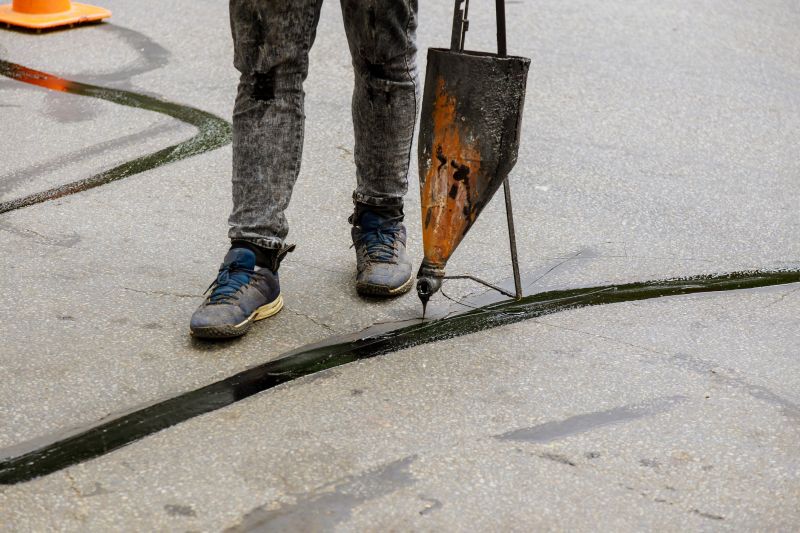 Applying sealcoat with specialized equipment